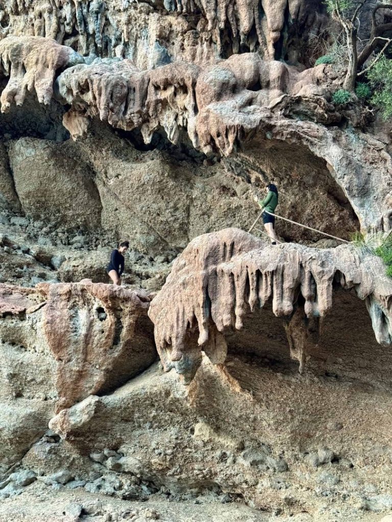 Foradada Hike Mallorca: hikers exploring unique rock formations, rugged terrain and natural coastal landscape
