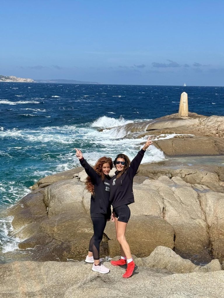 Fisherman Hike Sardinia hikers on rocky coastline with sea views, waves and scenic coastal landscape on intermediate trail