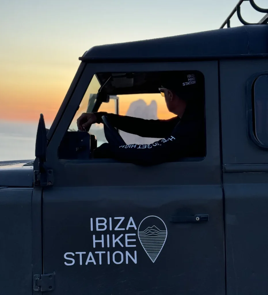Hiking guide in an off-road car during sunset in Ibiza